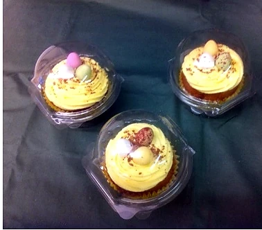 Three small Easter cakes topped with mini chocolate eggs